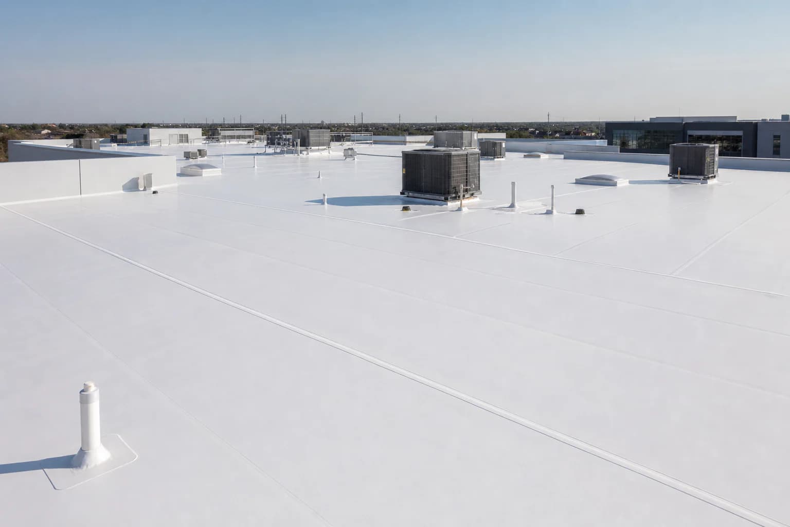 Illustrative white TPO membrane roof with heat-welded field seams