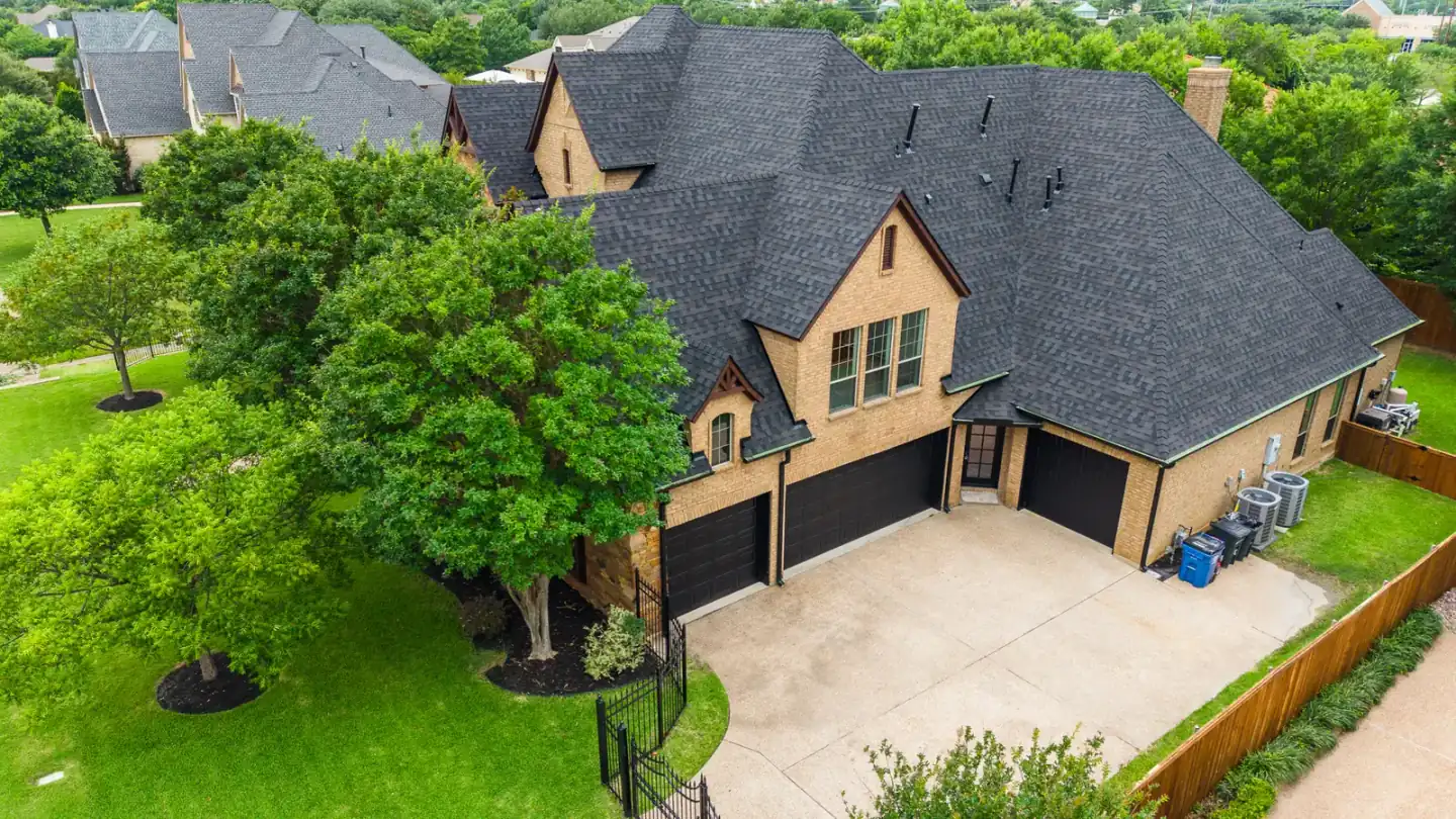 Broad aerial view of a completed residential roof in North Texas