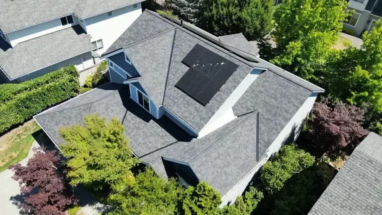 Aerial view of solar panels installed on a residential roof