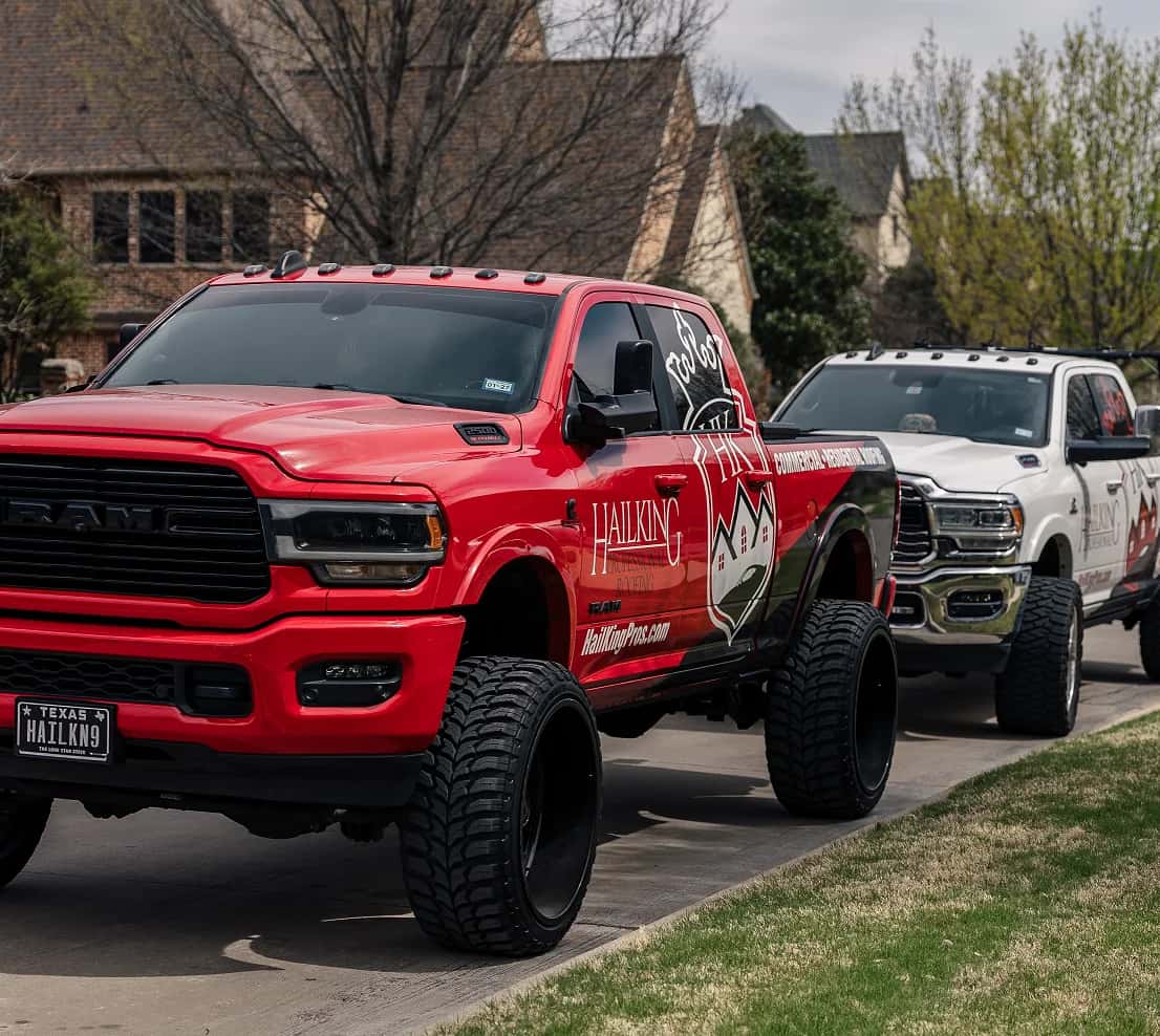 HailKing Professionals service trucks staged in a North Texas neighborhood