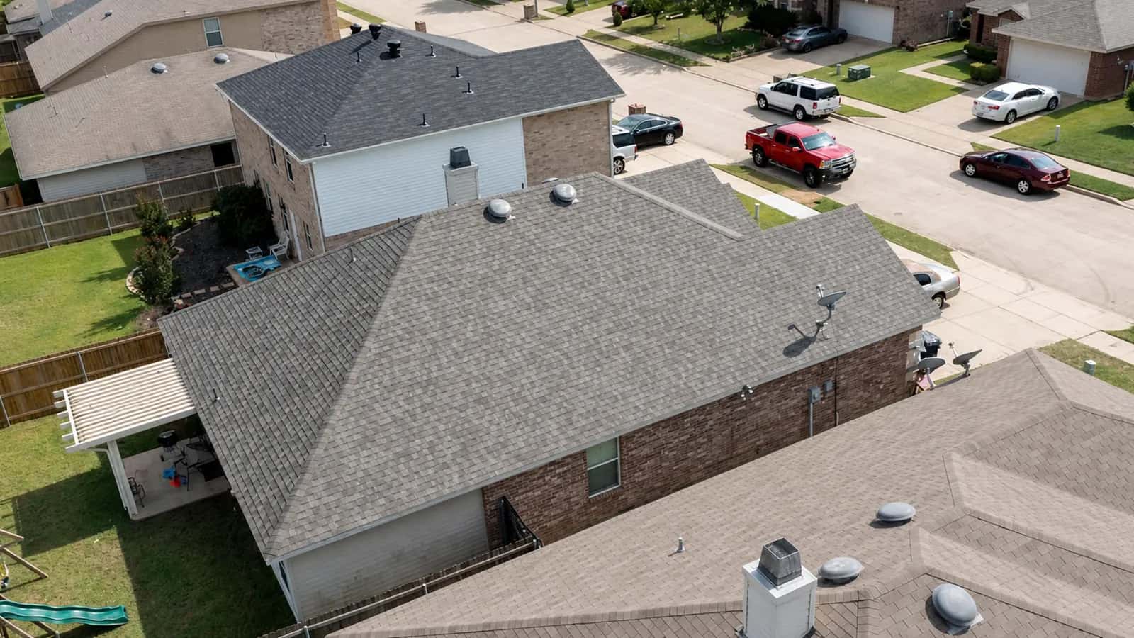 Aerial view of an impact-resistant shingle roof on a North Texas home