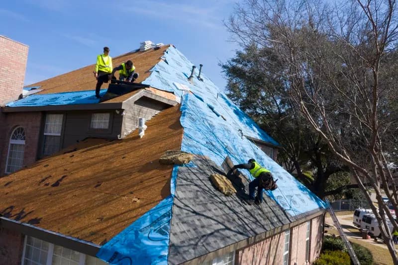 Roofing crew preparing a residential roof deck
