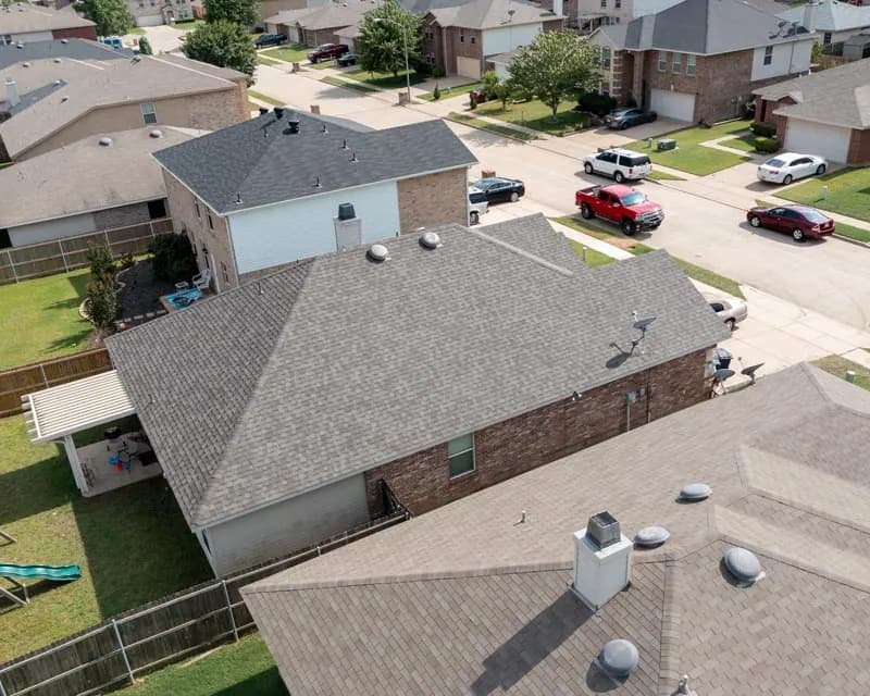 Aerial view of a completed residential roofing system