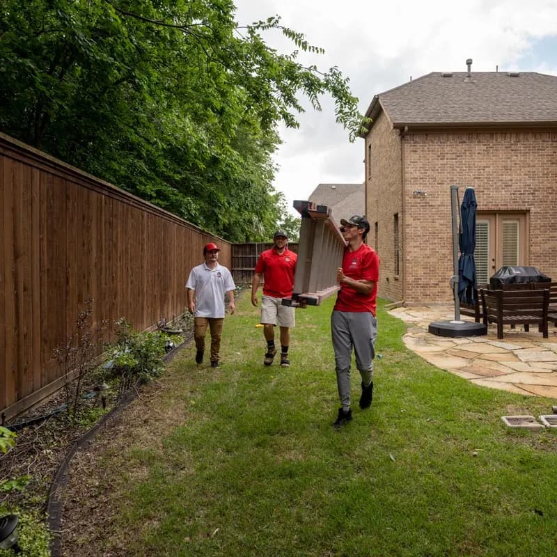 HailKing representatives meeting beside a home