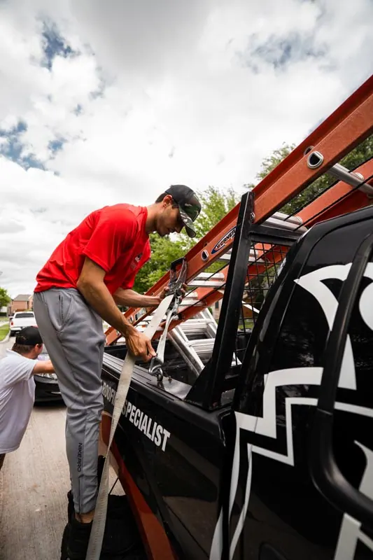 Team member preparing a HailKing project vehicle