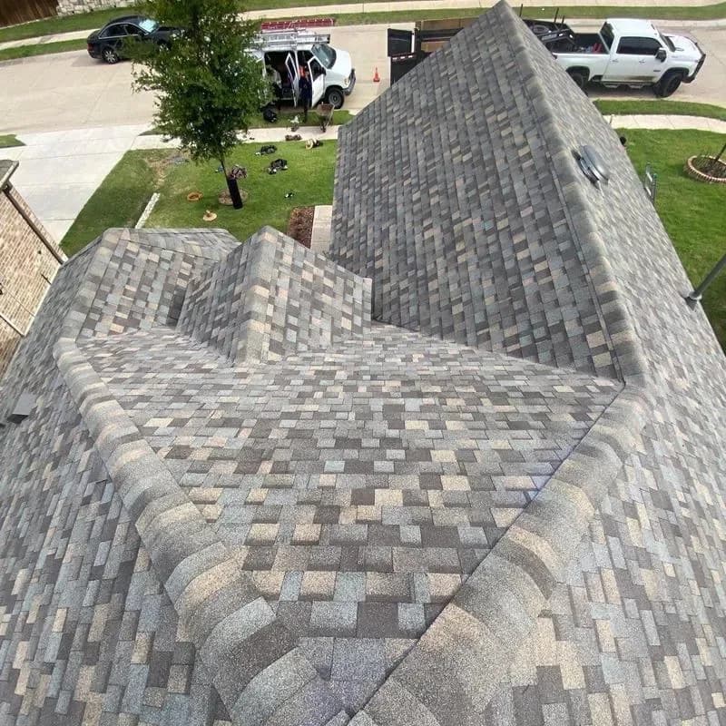 Completed shingle roof with finished ridges and valleys