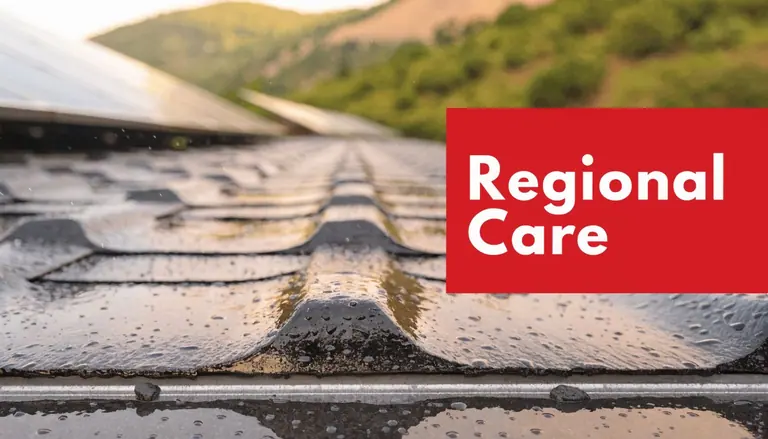 Raindrops on a dark textured asphalt shingle roof with a red regional care graphic overlay.