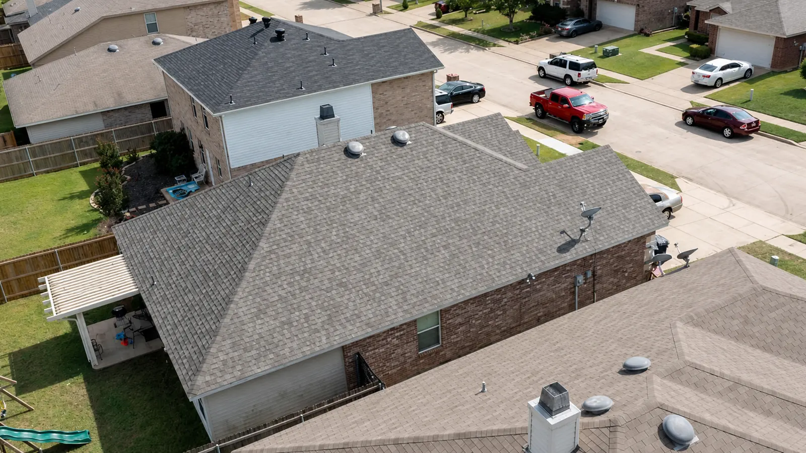 Aerial view of an impact-resistant shingle roof on a North Texas home