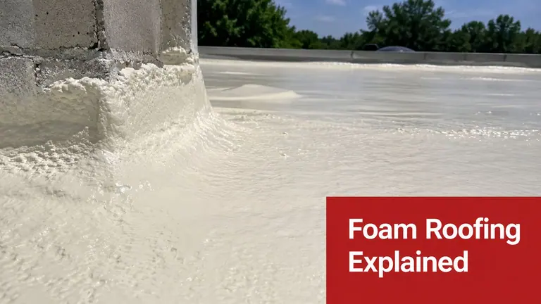 A close-up view of a newly applied white polyurethane foam roof with a smooth protective coating.
