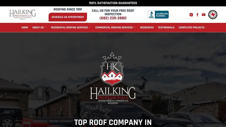 A professional roofer inspects a residential shingle roof with a modern home in the background.