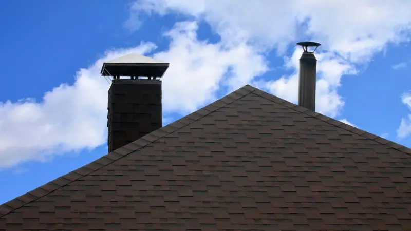 The roof covered with a modern flat bituminous waterproof coating under a blue sky